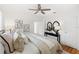 Bright main bedroom featuring a king bed, stylish decor, and refinished hardwood flooring at 516 14Th Ne Ave, St Petersburg, FL 33701