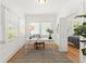 Bright home office with natural light, desk, and view into the bedroom at 516 14Th Ne Ave, St Petersburg, FL 33701