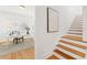 Sunlit office space with hardwood floors, desk, and staircase in view at 516 14Th Ne Ave, St Petersburg, FL 33701