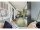 Inviting porch with swing, tile flooring, and paneled door at 516 14Th Ne Ave, St Petersburg, FL 33701