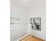 Upstairs landing with refinished wood floor and window at 516 14Th Ne Ave, St Petersburg, FL 33701