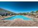 Relax and unwind at the community pool surrounded by swaying palms and comfortable lounge chairs under the bright sunny sky at 5225 5Th N Way, St Petersburg, FL 33703