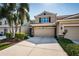 Inviting home exterior with a neutral stucco finish, stone accents and landscaped yard at 5225 5Th N Way, St Petersburg, FL 33703