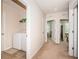 Hallway with easy access to the laundry room and adjacent bedrooms at 5225 5Th N Way, St Petersburg, FL 33703