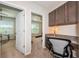 Home office features built-in desk with granite countertop and storage cabinets at 5225 5Th N Way, St Petersburg, FL 33703