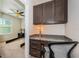 Built-in home office with granite countertops and overhead cabinets storage solutions at 5225 5Th N Way, St Petersburg, FL 33703