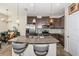 Stylish kitchen featuring granite countertops, stainless appliances, a spacious island, and seating at 5225 5Th N Way, St Petersburg, FL 33703