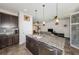 Modern kitchen with granite countertops, stainless steel appliances, and views to the living room at 5225 5Th N Way, St Petersburg, FL 33703