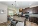 Open kitchen with granite countertops, stainless steel appliances, and bar stool seating at 5225 5Th N Way, St Petersburg, FL 33703