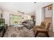 Inviting living room with plush carpeting, ample sunlight, and open floor plan at 5225 5Th N Way, St Petersburg, FL 33703
