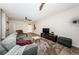 Spacious living room featuring a ceiling fan, television, and comfortable seating at 5225 5Th N Way, St Petersburg, FL 33703