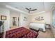 Spacious main bedroom with tray ceiling, fan, and decorative artwork at 5225 5Th N Way, St Petersburg, FL 33703