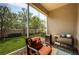 Cozy screened patio featuring a chair, small table and view of landscaped backyard at 5225 5Th N Way, St Petersburg, FL 33703