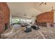 Elegant pool area with brick fireplace and bar seating provides an ideal spot for relaxation and entertaining poolside at 5225 5Th N Way, St Petersburg, FL 33703