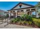 Charming pool house set amidst lush landscaping provides shade and refuge for residents looking to enjoy the community pool at 5225 5Th N Way, St Petersburg, FL 33703