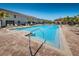 Large community pool with lounge chairs, palm trees, and easy access steps for residents to enjoy at 5225 5Th N Way, St Petersburg, FL 33703