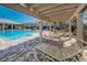Relax in the shade while lounging by the refreshing pool, perfect for enjoying the community amenities and warm sunny weather at 5225 5Th N Way, St Petersburg, FL 33703