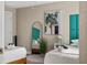 Stylish bedroom featuring two beds, trendy decor, and a view of the ceiling fan at 616 11Th Nw St, Largo, FL 33770