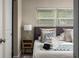 Inviting bedroom with a comfortable bed, side table, and calming decor at 616 11Th Nw St, Largo, FL 33770
