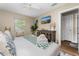 Bright bedroom with a decorative cabinet, a TV, and plenty of space at 616 11Th Nw St, Largo, FL 33770