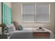 Close-up of the bed and window with plenty of natural light coming in at 616 11Th Nw St, Largo, FL 33770