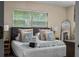 Comfortable bedroom with a plush bed, soft linens, and ample natural light at 616 11Th Nw St, Largo, FL 33770