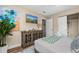 Serene bedroom featuring a decorative cabinet, a TV, and a comfortable bed at 616 11Th Nw St, Largo, FL 33770