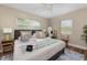 Bright bedroom with large windows, comfortable bed, and stylish coastal decor at 616 11Th Nw St, Largo, FL 33770