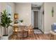Cozy dining area with a round table, stylish chairs, and decorative coastal accents at 616 11Th Nw St, Largo, FL 33770