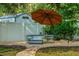 Backyard escape featuring a stylish round hot tub, offering a serene and private spa experience at 616 11Th Nw St, Largo, FL 33770