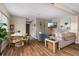 Cozy living area featuring modern furniture, beach-themed decor, and laminate wood flooring at 616 11Th Nw St, Largo, FL 33770