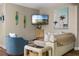 Inviting living room featuring stylish decor and beach themed art creating a relaxing atmosphere at 616 11Th Nw St, Largo, FL 33770