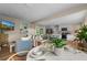 Open living room featuring a modern kitchen, comfortable seating, and stylish decor at 616 11Th Nw St, Largo, FL 33770