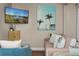 Comfortable living room features beach-themed art, modern decor, and cozy seating, perfect for relaxation at 616 11Th Nw St, Largo, FL 33770