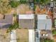 Aerial perspective of multiple homes showcasing roof quality and backyard layouts at 6269 50Th N Ave, St Petersburg, FL 33709