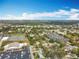 Expansive aerial view showcasing residential homes near tennis courts and community facilities at 6269 50Th N Ave, St Petersburg, FL 33709