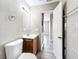 Updated bathroom with tile shower over tub, modern vanity, and gray flooring at 6269 50Th N Ave, St Petersburg, FL 33709