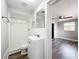 Bathroom features a tiled shower over tub, modern flooring, and a view to the bedroom at 6269 50Th N Ave, St Petersburg, FL 33709