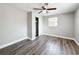 Bedroom featuring wood-look vinyl flooring, closet and fresh gray paint at 6269 50Th N Ave, St Petersburg, FL 33709