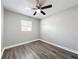 Bedroom with ceiling fan, window, and neutral paint that offers great natural light at 6269 50Th N Ave, St Petersburg, FL 33709