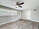 Bedroom with natural light, ceiling fan and wood-look vinyl flooring at 6269 50Th N Ave, St Petersburg, FL 33709