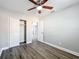 Bedroom featuring wood-look vinyl flooring, closet and fresh gray paint at 6269 50Th N Ave, St Petersburg, FL 33709