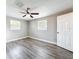 Bedroom featuring modern floors, ceiling fan, bright natural light, and fresh paint at 6269 50Th N Ave, St Petersburg, FL 33709