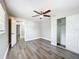 Bedroom featuring wood-look vinyl flooring, closet and fresh gray paint at 6269 50Th N Ave, St Petersburg, FL 33709