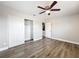 Bedroom featuring wood-look vinyl flooring, closet and fresh gray paint at 6269 50Th N Ave, St Petersburg, FL 33709