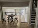 Welcoming entryway with open floor plan, tile flooring, and staircase to the upper level at 6906 Shady Pl, Tampa, FL 33634