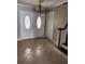 Bright foyer with tile flooring, decorative mosaic, stairs and classic chandelier at 6906 Shady Pl, Tampa, FL 33634