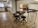 View of the open kitchen and breakfast table area by the staircase and overlooking the living area at 6906 Shady Pl, Tampa, FL 33634