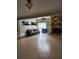 Spacious living room with tile floors and a unique stone fireplace at 6906 Shady Pl, Tampa, FL 33634