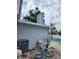 Exterior of the home featuring pool equipment alongside the swimming pool and house siding at 6906 Shady Pl, Tampa, FL 33634